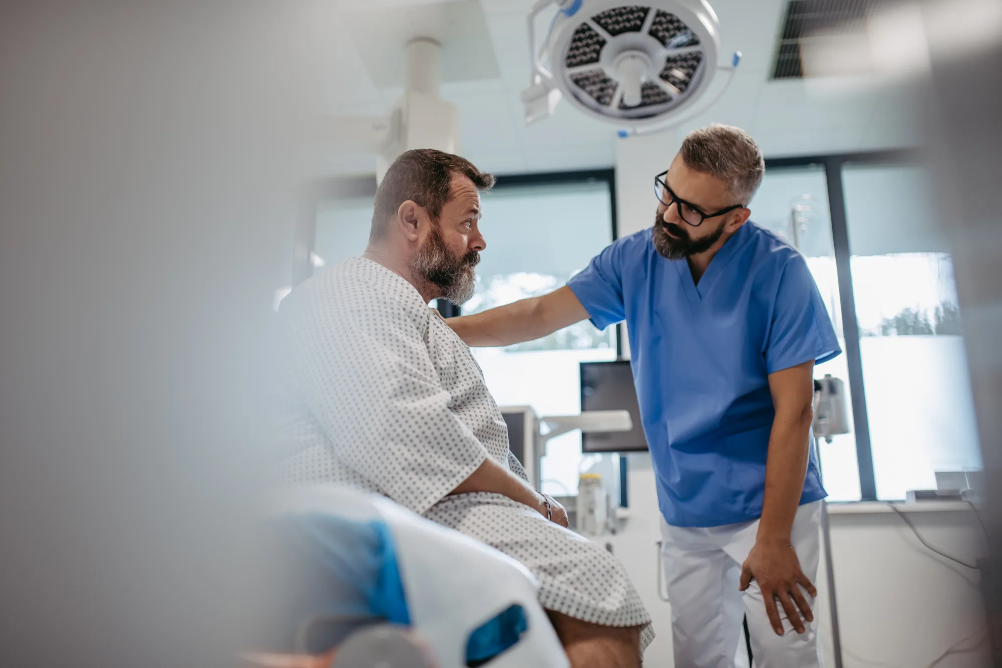 A New Jersey man being consulted by a spinal surgeon prior to surgery.