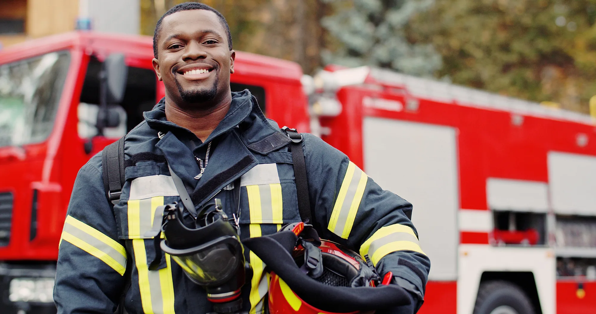 A New Jersey firefighter smiling at the camera