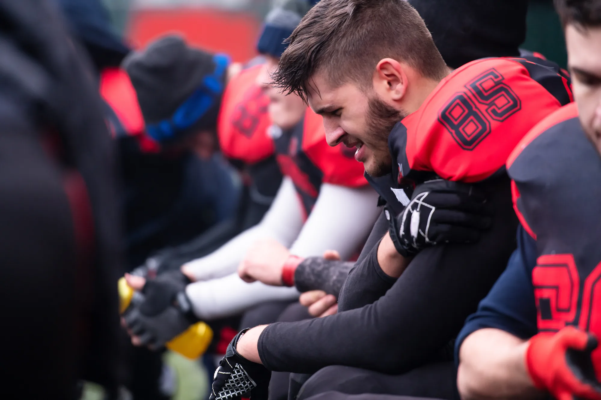 A football player in pain from excessive force in his sport