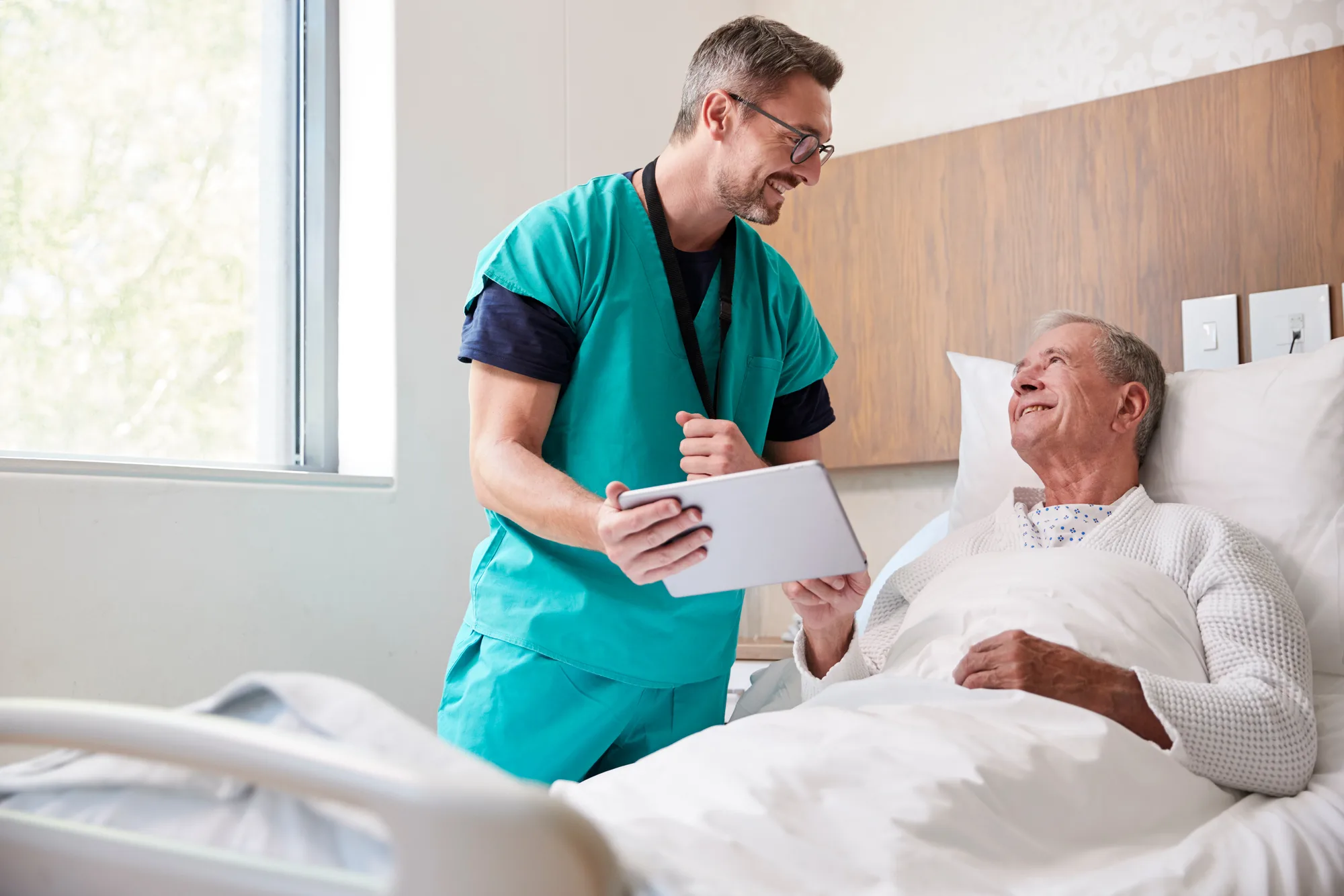 New Jersey nurse reassuring a patient prior to spinal surgery.
