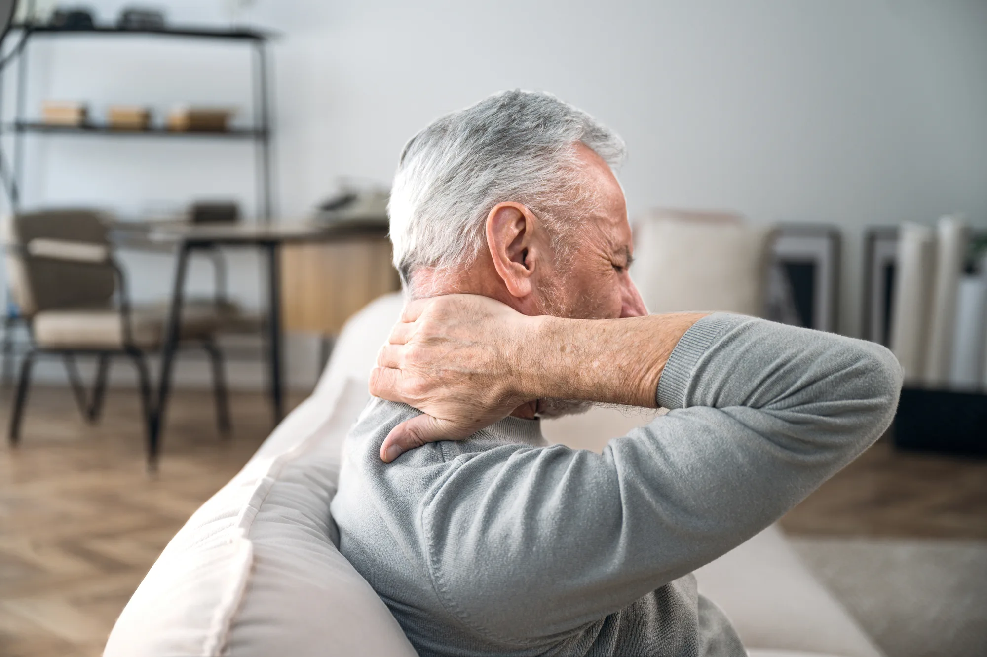 An older New Jersey man experiencing neck pain.