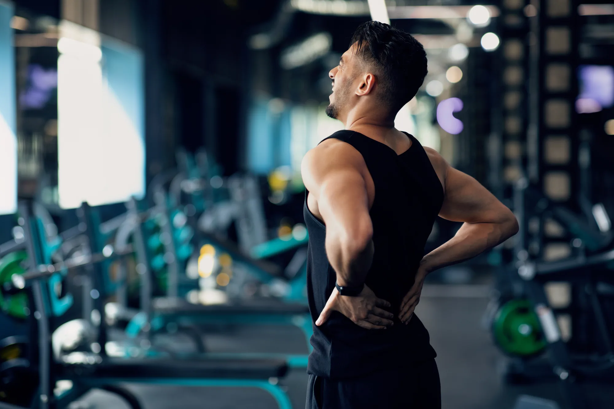Young New Jersey man experiencing lower back pain
